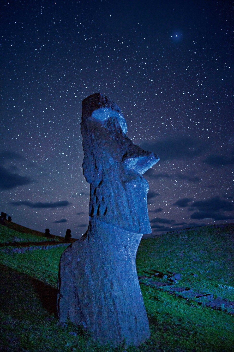 An ancient Moai statue on a hillside at night on Easter Island (Rapa Nui) in the south-eastern Pacific Ocean.  The island falls within Chilean territory and its government has proposed the Easter Island Marine Park, which would protect more than 630,000 square kilometres of ocean. <br />
Photo by Randy Olson | National Geographic Creative